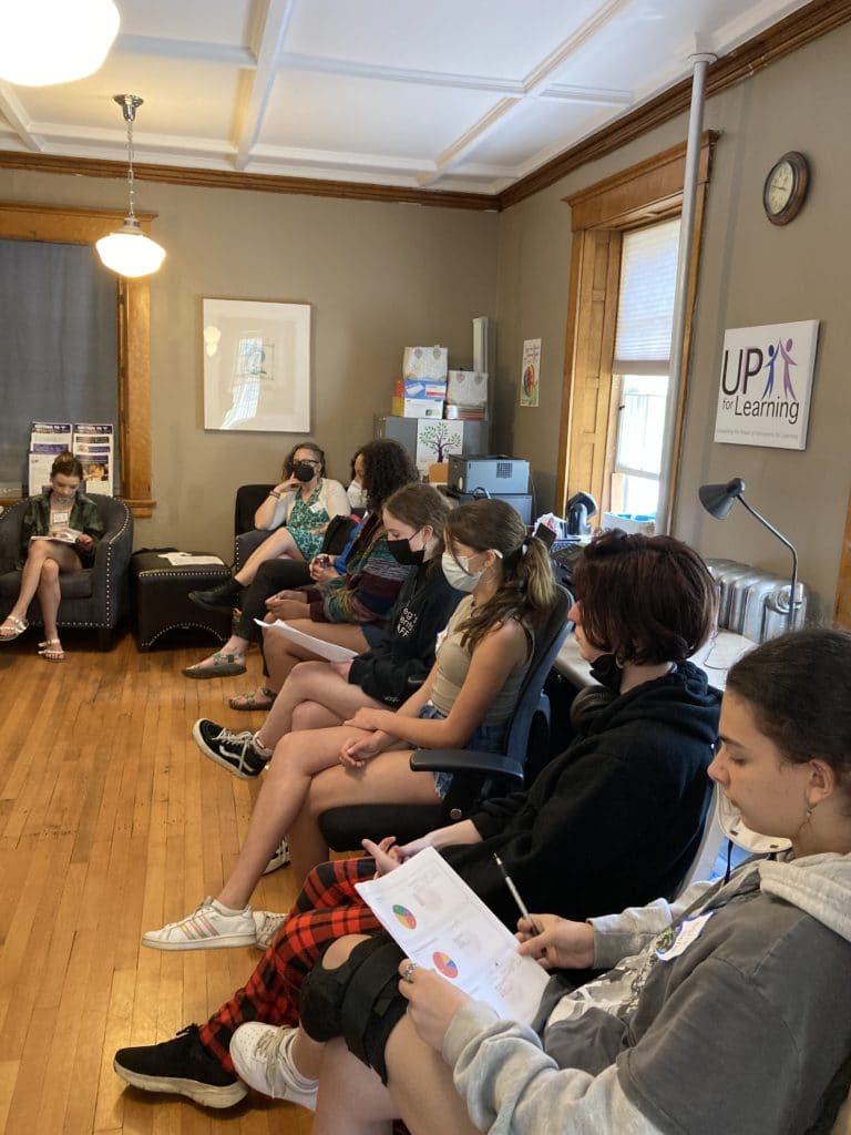 a group of people sitting in a room