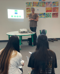 a person standing in front of a classroom