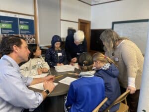 a group of people in a meeting